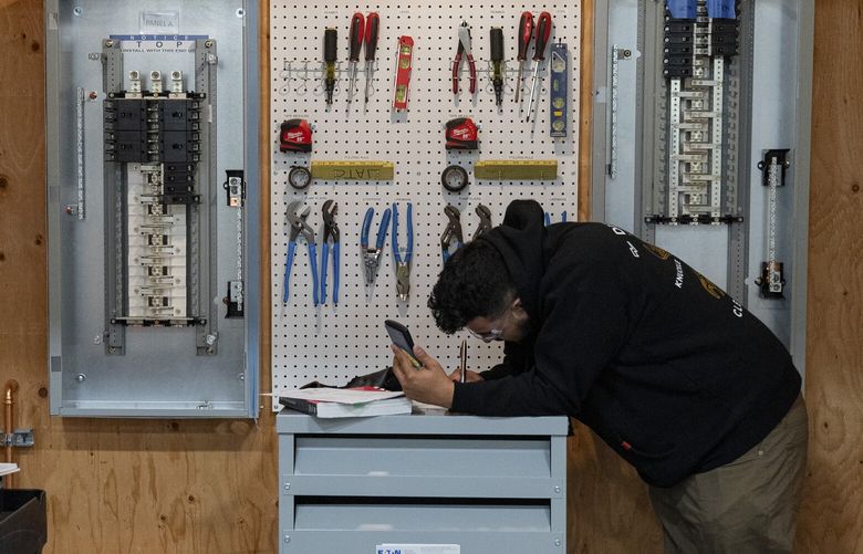 Alejandro Garcia, a third-year electrical apprentice, completes a lab assignment at the Wenatchee Area Technical Training Site in East Wenatchee on Dec. 4, 2024. The rural region is changing fast as electricians from around the country plug the tech industry’s new, giant data centers into its ample power supply. (Jovelle Tamayo / The New York Times)