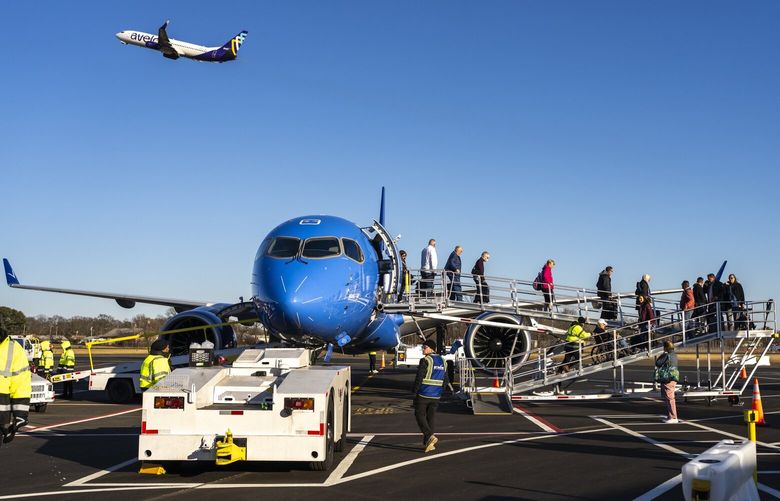Passengers deplane a Breeze Airways flight at Tweed-New Haven Regional Airport in New Haven, Conn., Dec. 13, 2024. Avelo Airlines and Breeze Airways have found success and loyal customers by serving airports in smaller cities that were neglected by national carriers. (Christopher Capozziello/The New York Times) XNYT0372