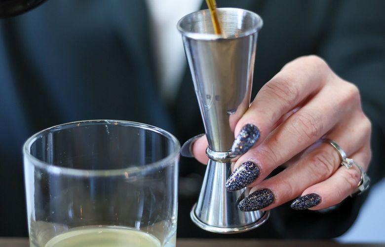 Kirstin Vracko, co-owner of Cheeky & Dry, makes a ‘Ringa In The New Year’ at her new non-alcoholic bottle shop in the Phinney Ridge neighborhood of north Seattle, Washington, on January 11, 2024.
 225921