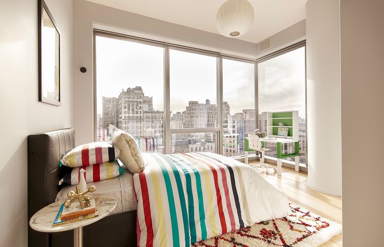 Stripes in various colors provide a graphic, yet sophisticated look in this guest bedroom. (Scott Gabriel Morris/TNS)