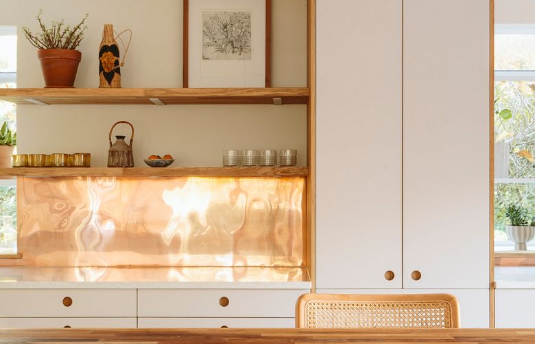 A copper backsplash designed by Open Studio Collective. (Kaitlin Green via The New York Times)
