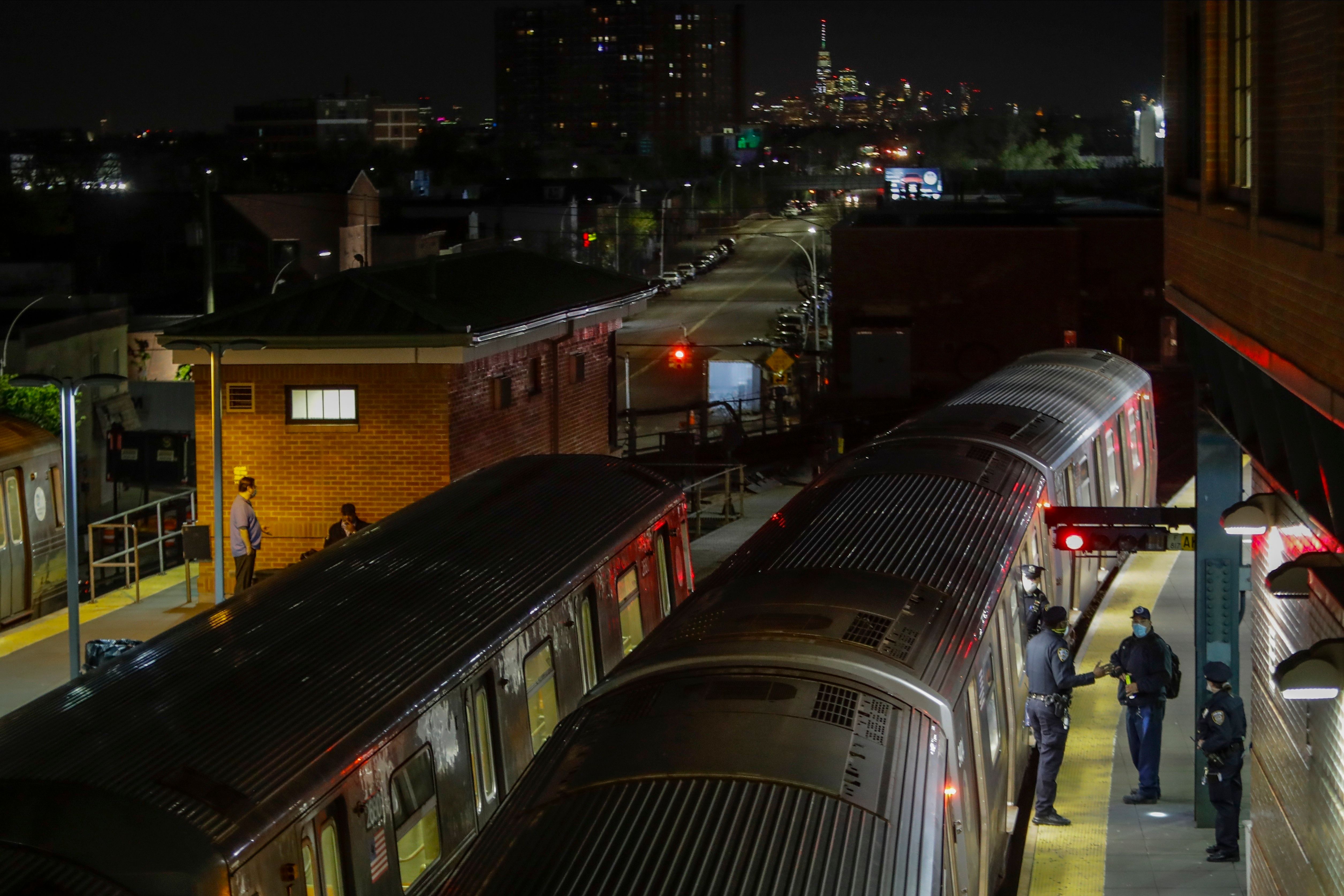 New York City police investigate the death of a woman found on fire in subway car