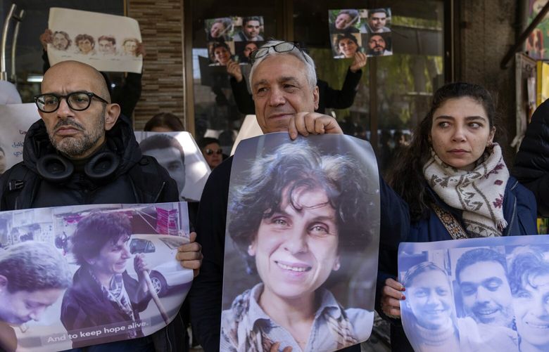 Relatives take part in a protest demanding the whereabouts of four activists who disappeared during the war between opposition groups and former President Bashar Assad’s forces, in Douma, Syria, Wednesday, Jan. 1, 2025. (AP Photo/Mosa’ab Elshamy) XMS102 XMS102