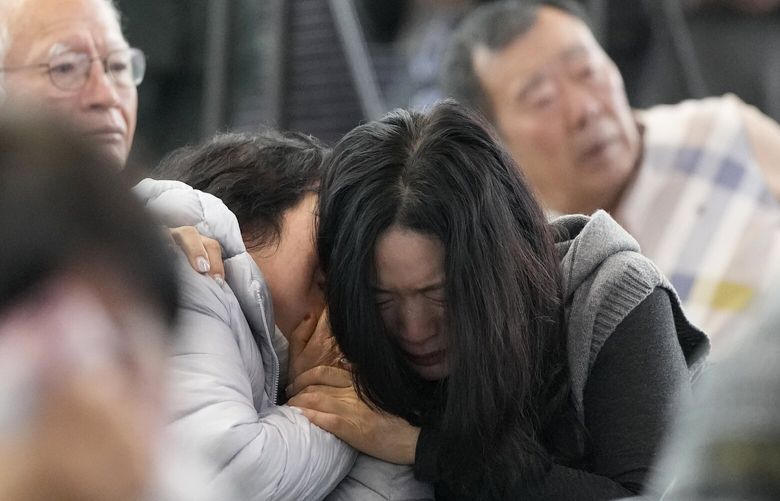 FILE – Relatives of passengers on a plane which skidded off a runway and burst into flames, react at Muan International Airport in Muan, South Korea, Monday, Dec. 30, 2024. (AP Photo/Ahn Young-joon, FILE) SEL101 SEL101