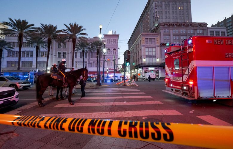 Police cordon off the intersection of Canal Street and Bourbon Street in the French Quarter of New Orleans on Wednesday, Jan. 1, 2025. At least 10 people were killed and 30 injured Wednesday when a vehicle plowed overnight into a New Year’s crowd in the heart of the thriving New Orleans tourist district, authorities said. (Matthew Hinton/AFP/Getty Images/TNS) 131088744W 131088744W