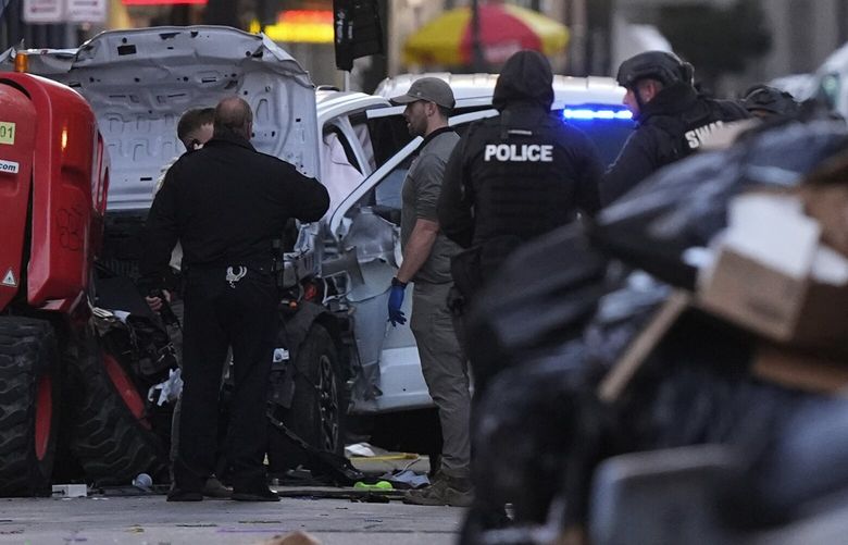 EDS NOTE: GRAPHIC CONTENT – Emergency personnel work the scene on Bourbon Street after a vehicle drove into a crowd on New Orleans’ Canal and Bourbon Street, Wednesday Jan. 1, 2025. (AP Photo/Gerald Herbert) LBJ128 LBJ128