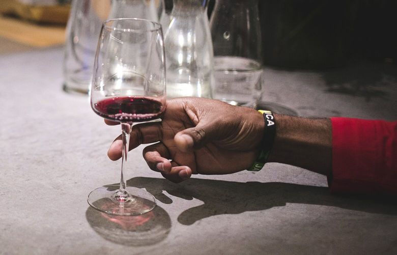 FILE – A diner with a glass of wine at a restaurant in Ketchum, Idaho, on Jan. 13, 2019. The evidence against drinking has been evolving for years now. But that was not reflected in the last update of the U.S. Dietary Guidelines in 2020, and may not be in the 2025 revision either. (Tamara Kenyon/The New York Times)