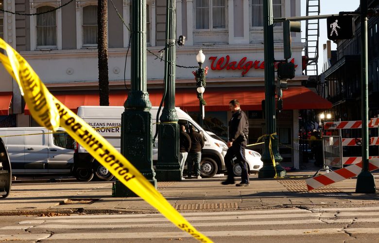 Emergency personnel near the scene, hours after a man drove a pickup truck into people in the French Quarter of New Orleans, on Wednesday, Jan. 1, 2025. A man drove a pickup truck into crowds celebrating the New Year on Bourbon Street in the early morning, killing at least 10 people and injuring dozens. (Edmund D. Fountain/The New York Times)