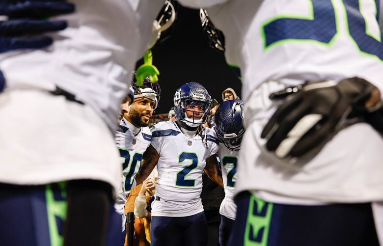 Rayshawn Jenkins (20), Julian Love, and Seattle defenders gather before Thursday’s game.  The Seattle Seahawks played the Chicago Bears in NFL Football Thursday, Dec. 26, 2024 at Soldier Field, in Chicago, IL. 228833