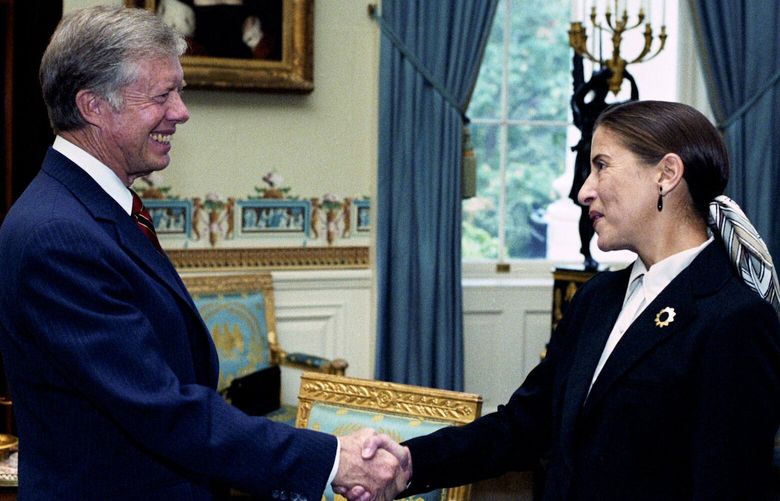 Ruth Bader Ginsburg and President Jimmy Carter shake hands around 1980. When Carter nominated her to the U.S. Court of Appeals for the D.C. Circuit, her husband, Marty, gave up his law partnership to follow her to the new job. MUST CREDIT: Magnolia Pictures