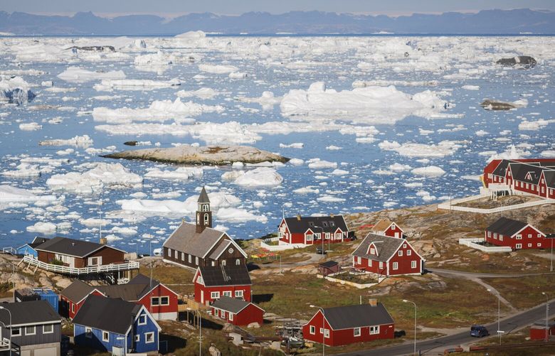 A view of Ilulissat, Greenland, a town of less than 5,000 people, and the icebergs in Disko Bay, Sept. 2, 2021. “Borgen,” the acclaimed Danish series, returns for a fourth season, which focuses on a geopolitical crisis brewing in Greenland. (Carsten Snejbjerg/The New York Times) XNYT93
