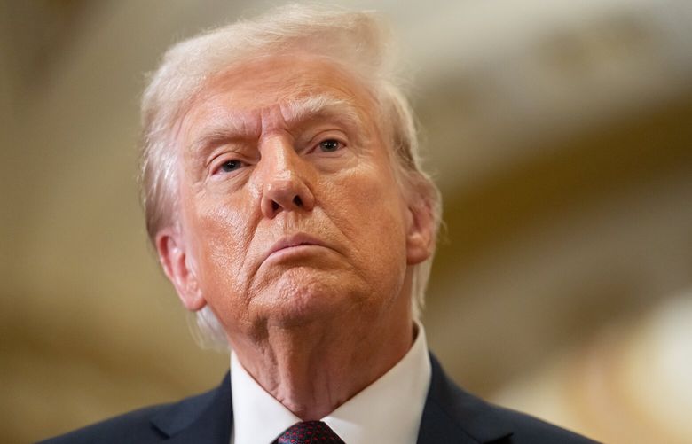 Donald Trump speaks to reporters Wednesday after a meeting with GOP Senators on Capitol Hill. MUST CREDIT: Craig Hudson for The Washington Post