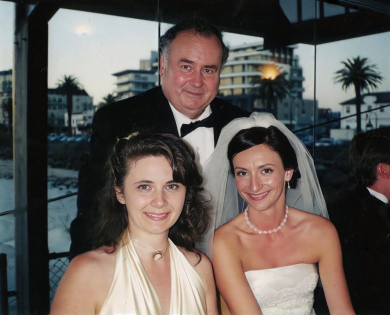 John Hart-Smith, back, is pictured with his daughters Sylvia, left, and Kate, at Kate&#8217;s wedding  in March 2003 at Port Melbourne, Australia. (Courtesy of family)