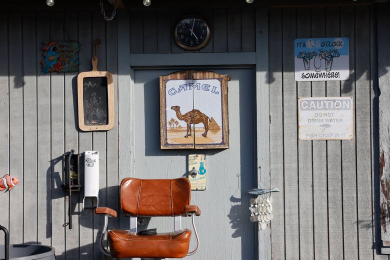 The end of the dock at Sagstad Marina in Ballard is a sunny place to hang out. (Karen Ducey / The Seattle Times)