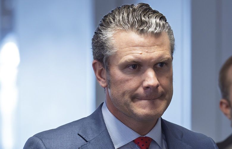 FILE – Pete Hegseth, President-elect Donald Trump’s nominee to be defense secretary, right, joined by his wife Jennifer Rauchet, arrives at the Capitol in Washington, Dec. 5, 2024. (AP Photo/J. Scott Applewhite, File) WX502 WX502