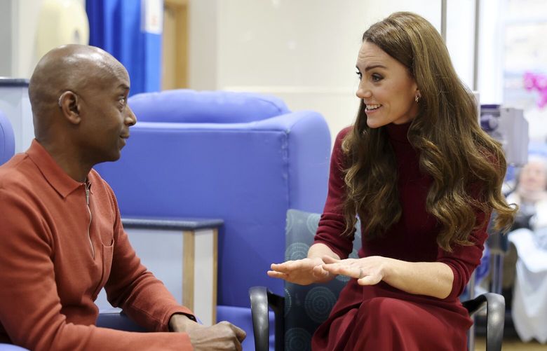 Britain’s Princess Kate talks with Peter Burton during a visit to The Royal Marsden Hospital, where she received her cancer treatment, in London, Tuesday Jan. 14, 2025 in London, England. (Chris Jackson/Pool Photo via AP) roy202 roy202