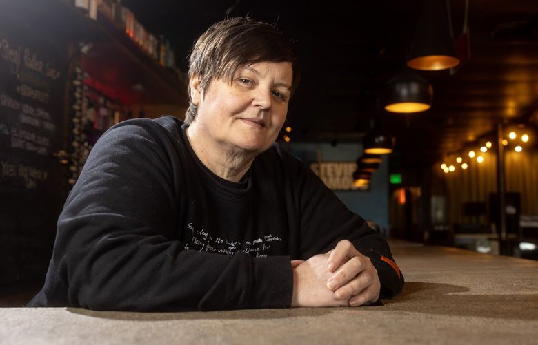 Jodi Ecklund, owner of Clock-Out Lounge in Beacon Hill, poses for a portrait on Tuesday, Jan. 14, 2025, in Seattle.