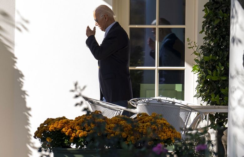 FILE — President Joe Biden gestures towards his head as he walks from the Oval Office and boards Marine One as he departs the White House on Wednesday, Nov. 1, 2023. President Biden’s closest family members and advisers recognized his physical frailty to a greater degree than they have publicly acknowledged and worked together to manage his decline. (Doug Mills/The New York Times) XNYT0283 XNYT0283