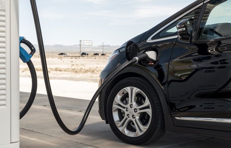 A Chevrolet Bolt EV charges at a charging station in Baker, Calif., April 18, 2019.  (Philip Cheung/The New York Times)