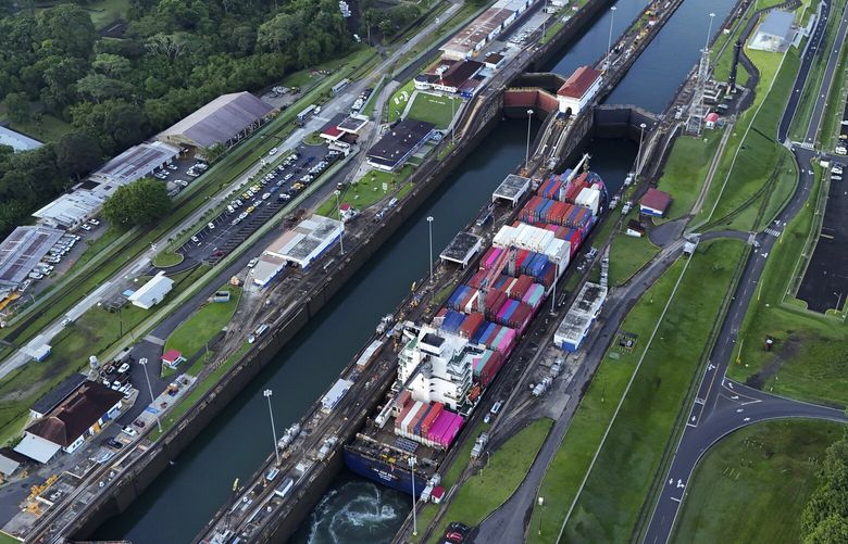 FILE – A cargo ship traverses the Agua Clara Locks of the Panama Canal in Colon, Panama, Sept. 2, 2024. (AP Photo/Matias Delacroix, File) NYRL510 NYRL510
