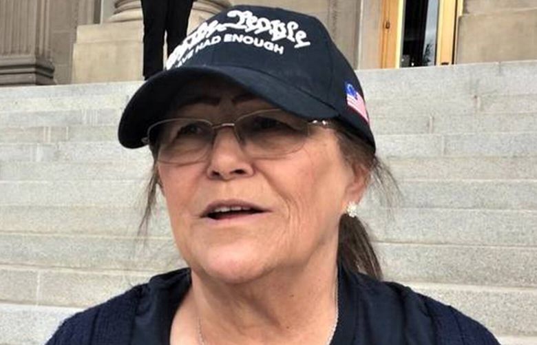 Boise’s Pam Hemphill is seen on the steps of the Idaho Capitol in 2020. A former Trump supporter, she has since changed her stance on the Jan. 6, 2021, riot at the U.S. Capitol that she participated in. (David Staats/Idaho Statesman/TNS) 132892169W 132892169W