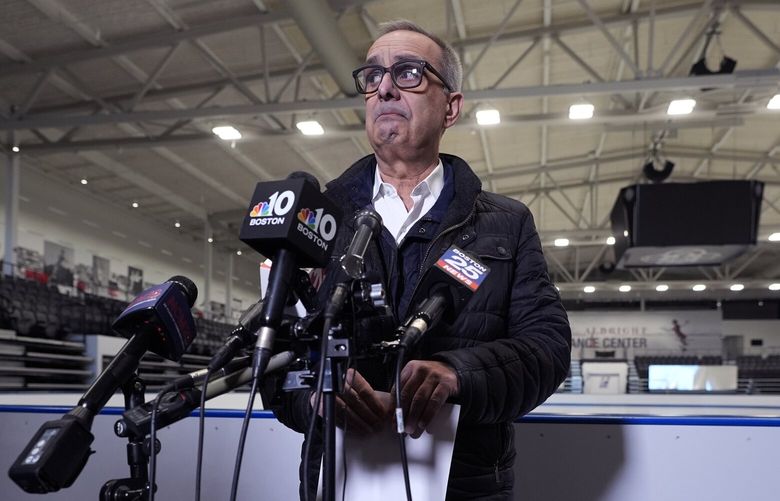 Doug Zeghibe, CEO and Executive Director of The Skating Club of Boston, pauses while announcing that six athletes, coaches and family are believed to have perished in the collision of a passenger aircraft and military helicopter in Washington, at the club’s figure skating rink, Thursday, Jan. 30, 2025, in Norwood, Mass. (AP Photo/Charles Krupa) MACK101 MACK101