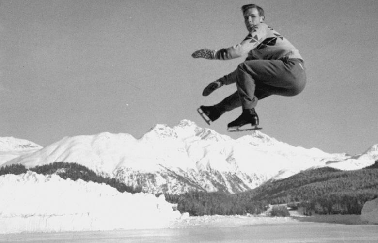 FILE – Dick Button of Englewood, N.J., U.S. and North American men’s figure skating champion, and winner of the European title, executes a jump during a practice session at St. Moritz, Switzerland, on Jan. 19, 1948, in preparation for the Winter Olympics of 1948. (AP Photo, File) NYPH502 NYPH502