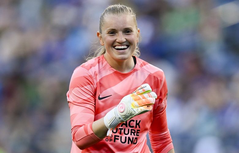 Seattle Reign FC goalkeeper Claudia Dickey (1) smiles during an NWSL soccer match, Sunday, March 17, 2024, in Seattle. (AP Photo/Alika Jenner) NYOTK