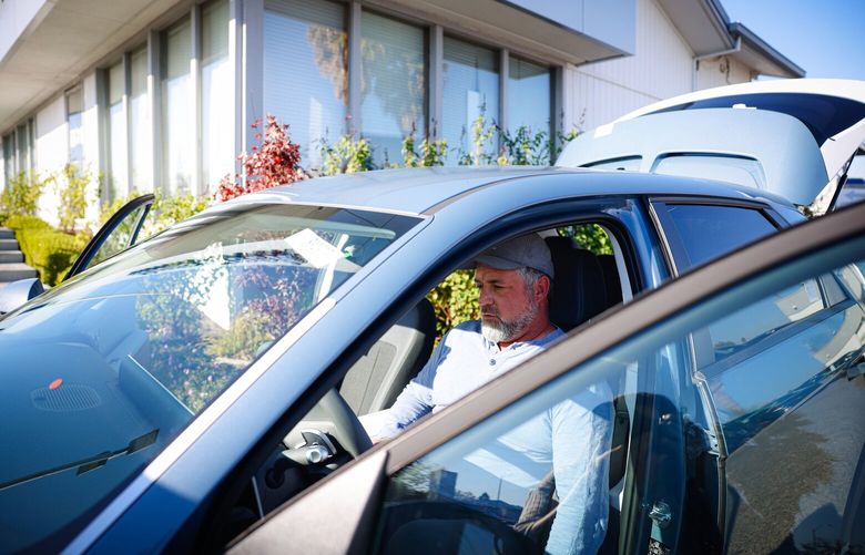 Ray Schubert, of Los Gatos, California, looks at the 2024 Hyundai Ioniq 5 for a friend, shopping for a car at Stevens Creek Hyundai in San Jose on Dec. 4, 2024. (Shae Hammond/Bay Area News Group/TNS)