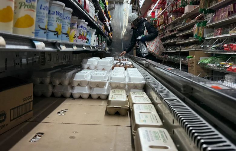 Eggs on display at a grocery store in Manhattan, Jan. 21, 2025. Avian influenza has led to a shortage of eggs and wholesale prices that are through the roof. Consumers can expect to feel the pain for a while. (John Taggart / The New York Times)