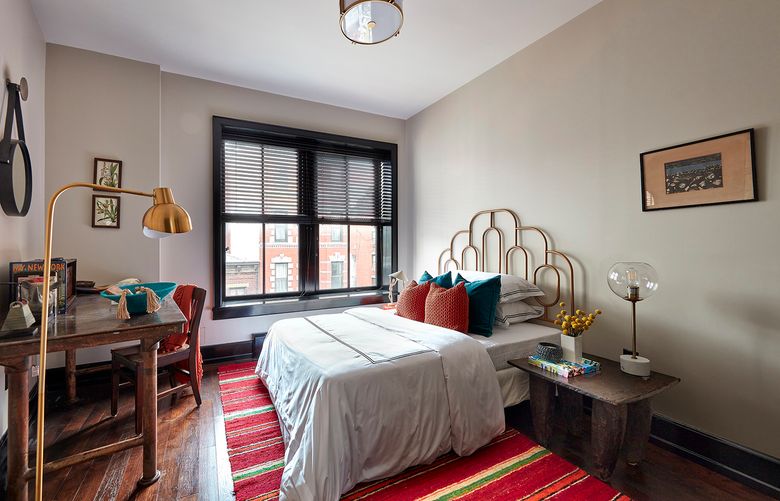 Tints, tones and shades of red help to add warmth and a sense of calm to this second bedroom. (Scott Gabriel Morris/TNS)