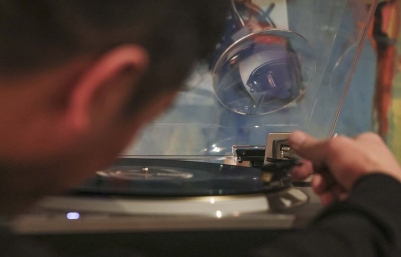 Co-owner and host Brian Rauschenbach drops the needle on a record player to begin a vinyl listening session of the album Blonde by Frank Ocean at Shibuya HiFi, a bar and vinyl listening experience, in Seattle on Thursday, Jan. 23, 2025. 

 229098