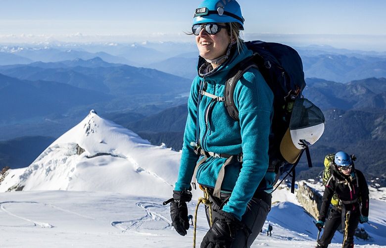 Students in a Northwest Alpine Guides intro to mountaineering class take in the views at Mount Baker.