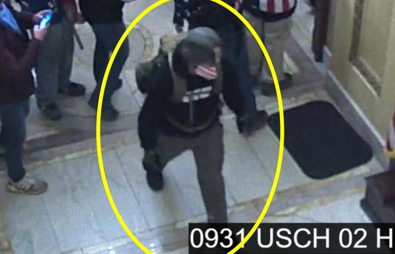 Edward Kelley, in the yellow circle added by investigators, with other rioters inside the U.S. Capitol on January 6, 2021, in a still from surveillance video. MUST CREDIT: Criminal complaint filed in the US.. District Court for the District of Columbia