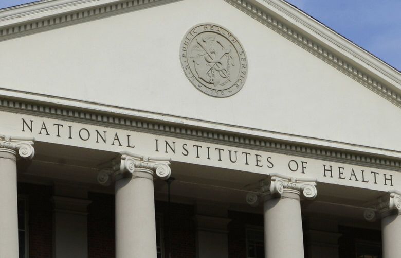 FILE – The administrative building of the National Institutes of Health is shown in Bethesda, Md., Aug. 17, 2009. (AP Photo/J. Scott Applewhite, File)