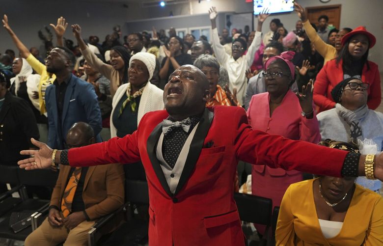 Jean-Michel Gisnel cries out while praying with other congregants at the First Haitian Evangelical Church of Springfield, Sunday, January 26, 2025, in Springfield, Ohio. (AP Photo/Luis Andres Henao) OHLH201 OHLH201
