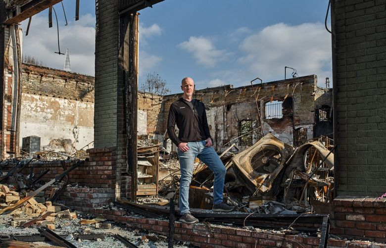 Tim Cadogan, chief executive of GoFundMe, in the remnants of a building that was devastated by the Eaton fire, in a commercial district of Altadena, Calif., Jan 29, 2025. Donations on the crowdfunding site to people and fire relief efforts have exceeded those for all natural disasters worldwide last year. (Philip Cheung/The New York Times) XNYT0143 XNYT0143