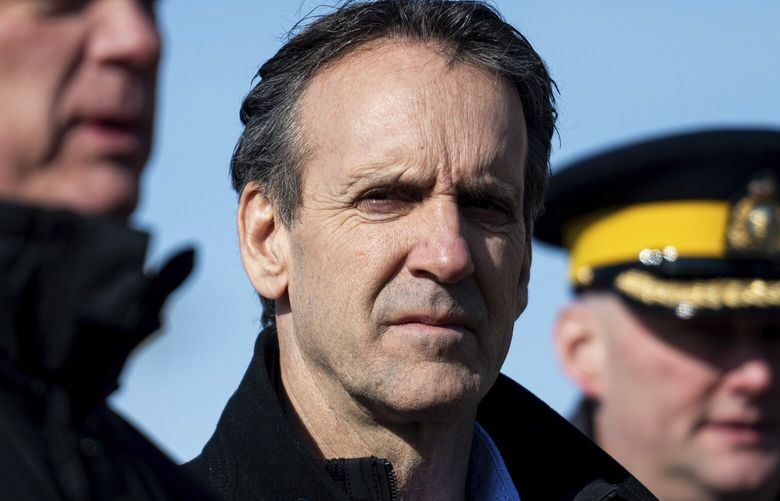 Canada’s fentanyl czar Kevin Brosseau, center, looks on as Minister of Public Safety David McGuinty, left, speaks during a press conference following a tour of the Canada Border Services Agency Lansdowne port of entry in Lansdowne, Ontario, Wednesday, Feb. 12, 2025. (Spencer Colby/The Canadian Press via AP) SPC109 SPC109