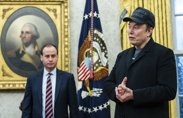 Elon Musk, who leads the so-called Department of Government Efficiency, speaks to reporters during an executive order signing with President Donald Trump in the Oval Office of the White House in Washington, on Tuesday, Feb. 11, 2025. Spending that the White House does not like is being labeled fraudulent. At the same time, President Trump is rolling back anticorruption efforts and ethical standards for himself and allies like Musk. (Eric Lee/The New York Times) XNYT0611 XNYT0611