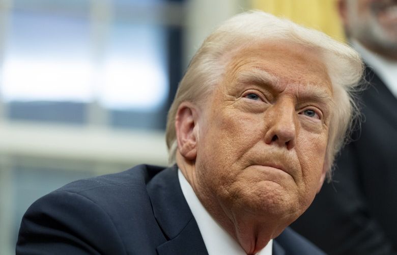 FILE – President Donald Trump speaks with reporters as he signs executive orders in the Oval Office at the White House, Monday, Feb. 10, 2025, in Washington. (AP Photo/Alex Brandon, file) NYRL801 NYRL801