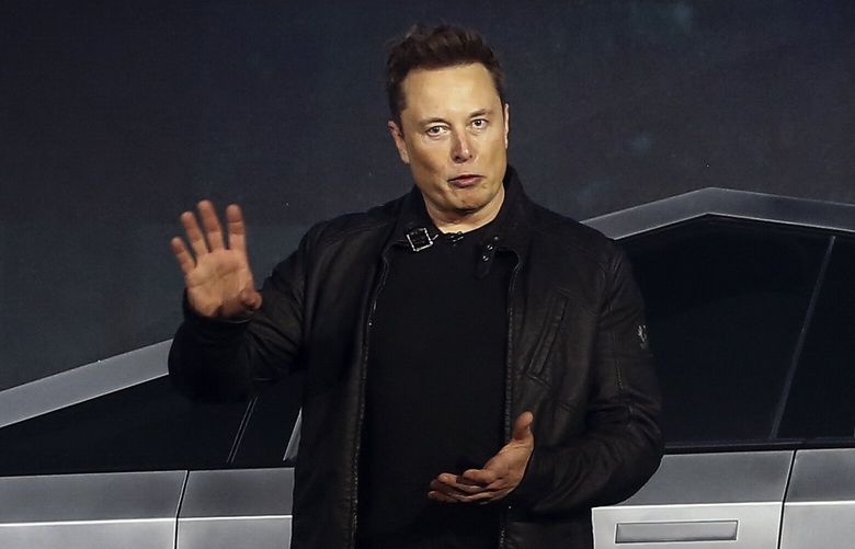 Tesla CEO Elon Musk introduces the Cybertruck at Tesla’s design studio Thursday, Nov. 21, 2019, in Hawthorne, Calif. Musk is taking on the workhorse heavy pickup truck market with his latest electric vehicle. (AP Photo/Ringo H.W. Chiu)
