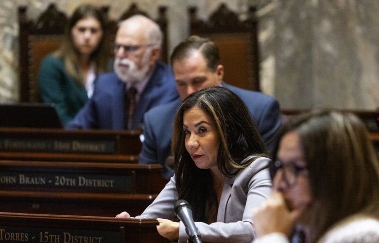 Sen. Nikki Torres, R-15th District, center, on the Senate floor during the opening day of the 2025 legislative session, Monday, Jan. 13, 2025, in Olympia.