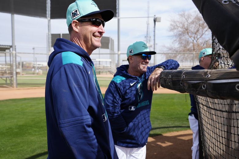 Mariners manager Dan Wilson and hitting coach Edgar Martinez take in the first day of spring training together on Thursday, Feb. 13, 2025 in Peoria, Ariz. (Ben VanHouten / Seattle Mariners)