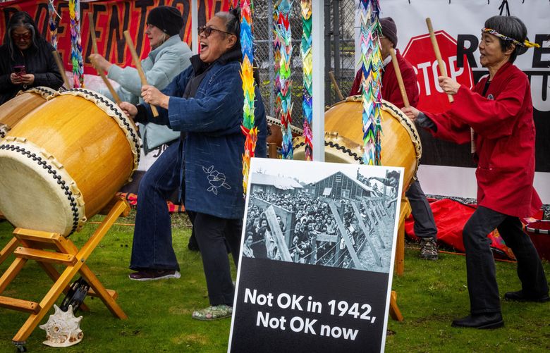 Karen Sakata, center, of Northwest Taiko leads Taiko drumming during a protest outside the Northwest ICE Processing Center in February 2024. (Ken Lambert / The Seattle Times)