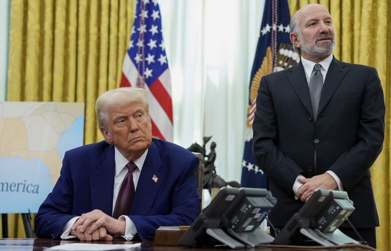 President Donald Trump and Howard Lutnick, his nominee for commerce secretary, in the Oval Office where Trump announced new ‘reciprocal’ tariffs, on Thursday, Feb. 13, 2025. Trump’s move represents a bet that the United States will gain leverage by replacing global tariffs with its own tariffs, which are taxes on imports. (Eric Lee/The New York Times) XNYT0166 XNYT0166
