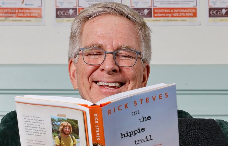 Rick Steves poses with a copy of his new book “On the Hippie Trail” Saturday, Jan. 26, 2025 in Edmonds, WA. 229089