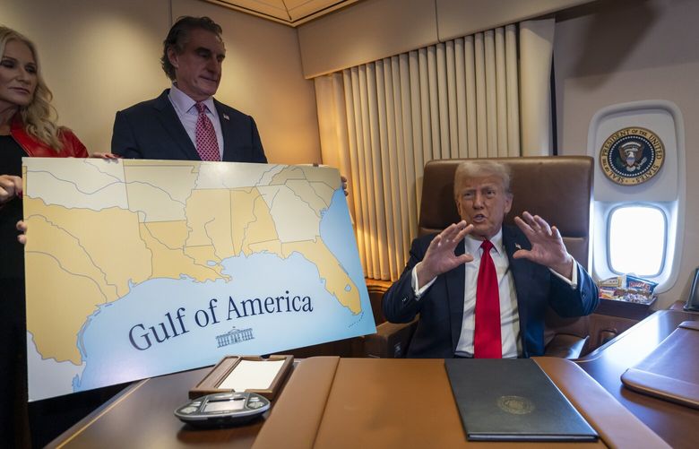President Donald Trump, from right, speaks to reporters accompanied by Interior Secretary Doug Burgum and Burgum’s wife Kathryn Burgum, aboard Air Force One where Trump signed a proclamation declaring Feb. 9 “the first ever Gulf of America Day,” as he travels from West Palm Beach, Fla. to New Orleans, Sunday, Feb. 9, 2025. (AP Photo/Ben Curtis) DCBC101 DCBC101