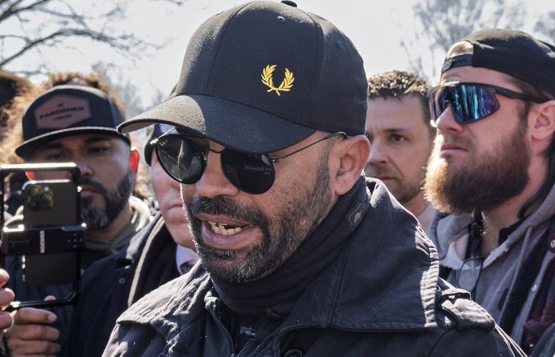 Former Proud Boys leader Enrique Tarrio, left, speaks at a news conference at the U.S. Capitol in Washington, Friday, Feb. 21, 2025, with Joseph Biggs, second from right.  (AP Photo/J. Scott Applewhite) DCSA109 DCSA109