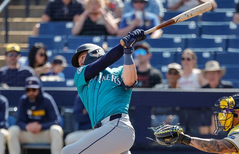 Mitch Haniger homers for Seattle in the first inning.  The Seattle Mariners played the Milwaukee Brewers in Spring Training baseball Monday, Feb. 24, 2025 at American Family Fields, in Phoenix, AZ. 229402