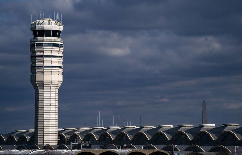 FILE — The control tower at Ronald Reagan Washington National Airport in Arlington, Va., on Feb. 1, 2025. Within the span of 90 minutes on Tuesday morning, Feb. 25, 2025, two airplanes, at Washington’s Ronald Reagan National Airport and at Chicago’s Midway International Airport, were forced to abort landings to avoid collisions, federal aviation officials said. (Kent Nishimura/The New York Times) XNYT0776 XNYT0776